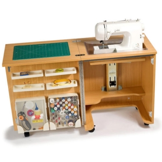 Horn Cub Plus 1010 Sewing Cabinet showing sewing machine in flat bed use.