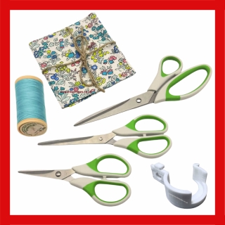Sewing bundle including thread, fabric, scissors and finger guard